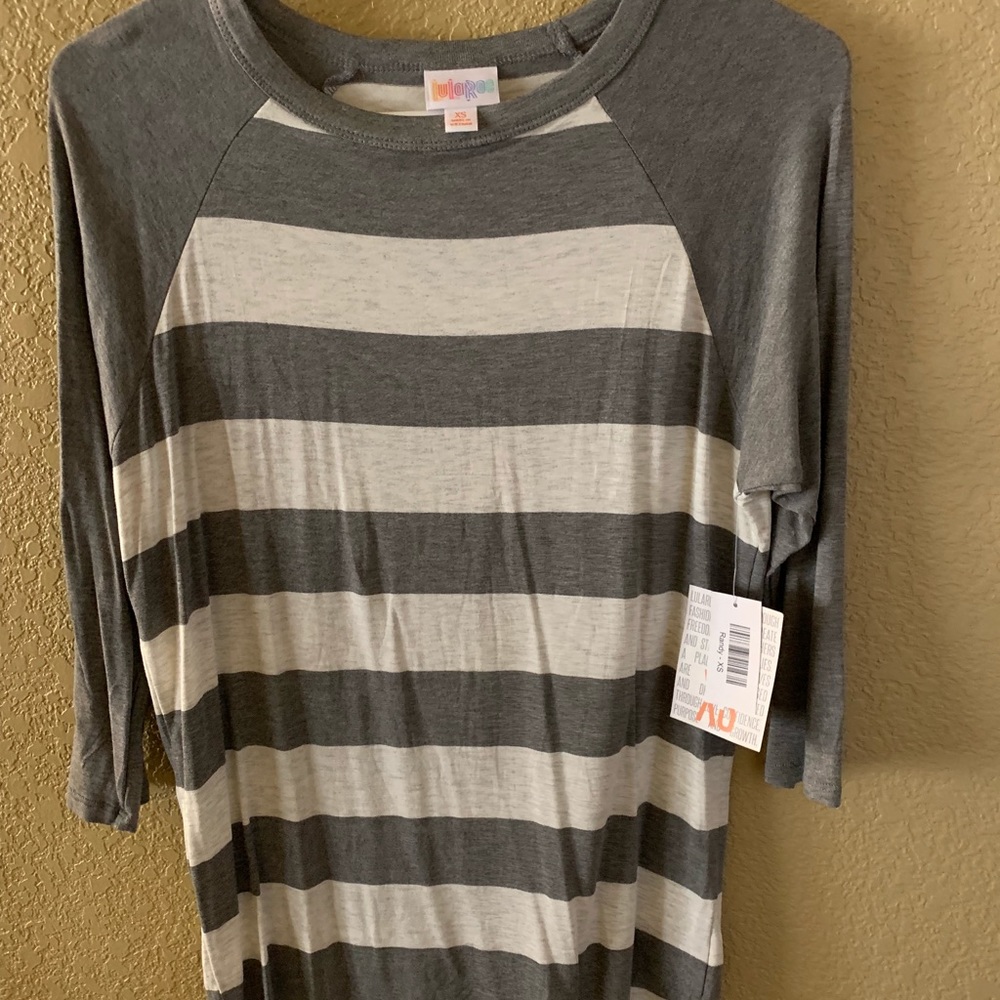 NWT.... Lularoe Randy raglan top. Size xs.